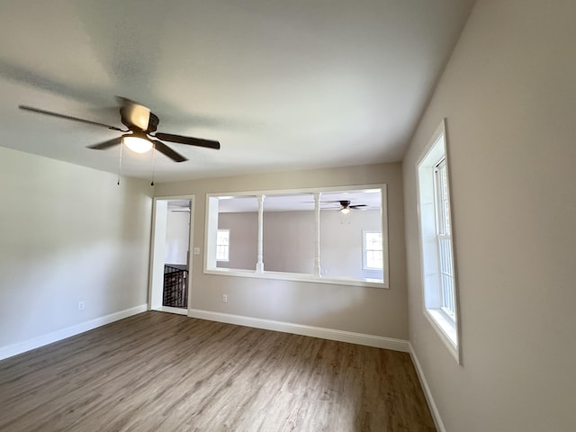 710 Gadsden Loop, Walterboro, SC 29488 - unfurnished room with a ceiling fan, wood finished floors, healthy amount of natural light, and baseboards