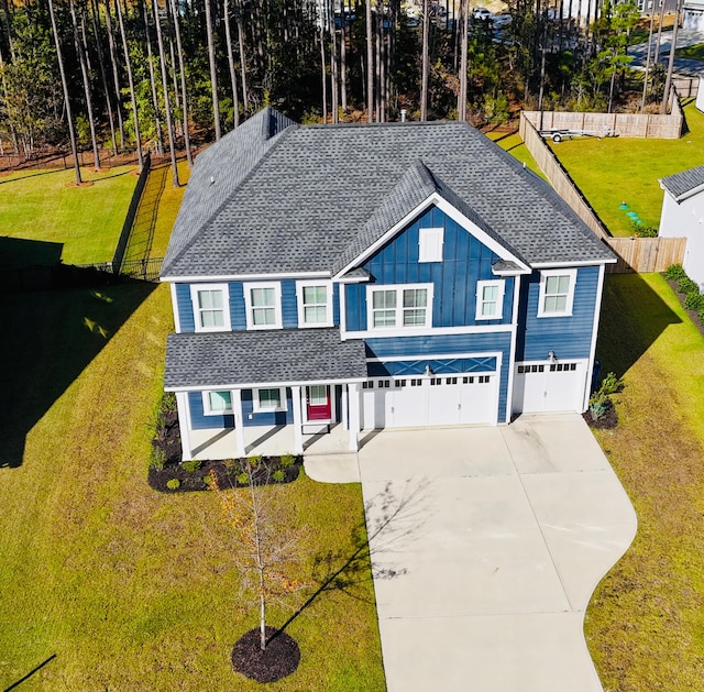 view of front facade with a garage and a front lawn