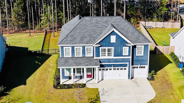 view of front of house featuring a front yard and a garage