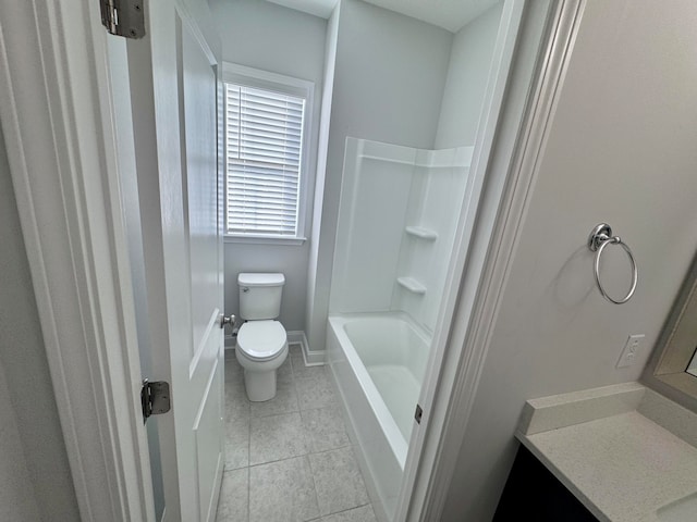 bathroom featuring toilet, vanity, and tile patterned floors