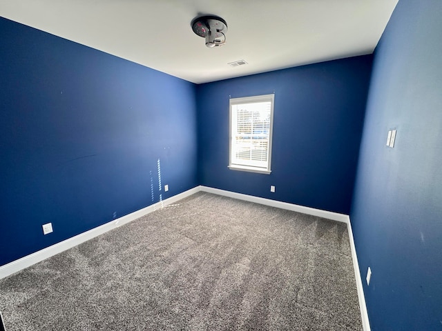 spare room with carpet floors