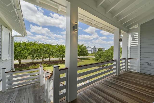 wooden terrace featuring covered porch