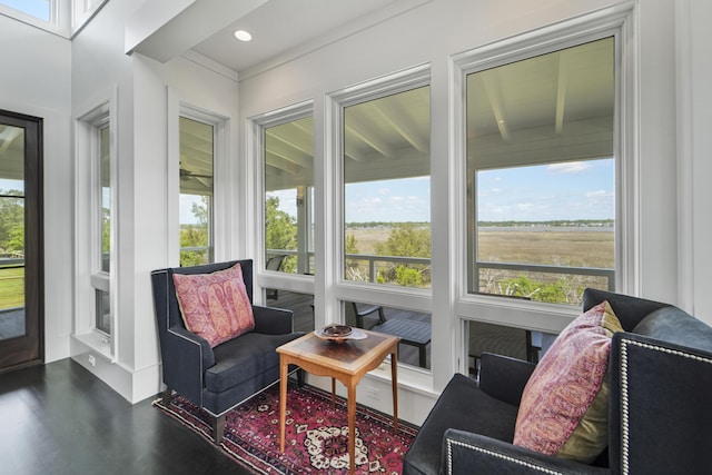sunroom / solarium with a healthy amount of sunlight, recessed lighting, and wood finished floors