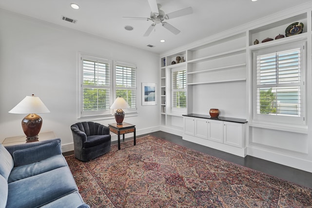 living area with baseboards, recessed lighting, built in shelves, and visible vents