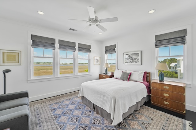 bedroom featuring visible vents, recessed lighting, baseboards, and multiple windows