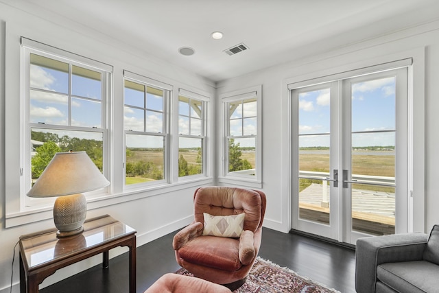 sunroom / solarium with plenty of natural light, french doors, and visible vents