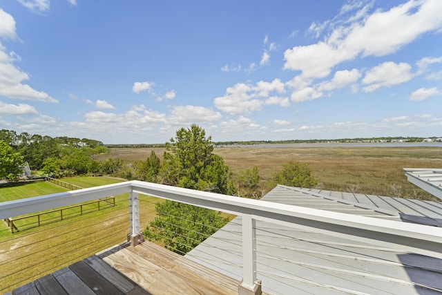 wooden deck with a rural view