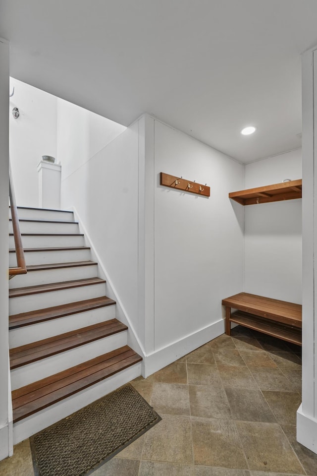 staircase featuring recessed lighting and baseboards