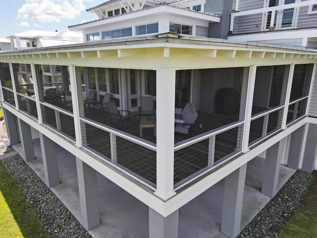 exterior space featuring a sunroom