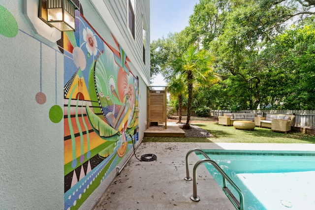 view of swimming pool featuring a patio area