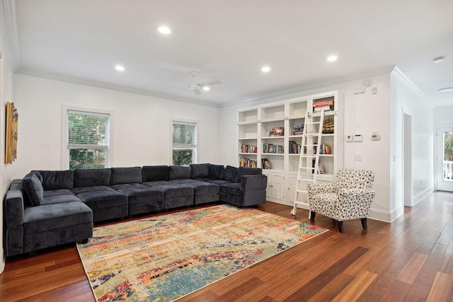 living room with ceiling fan, wood-type flooring, and crown molding