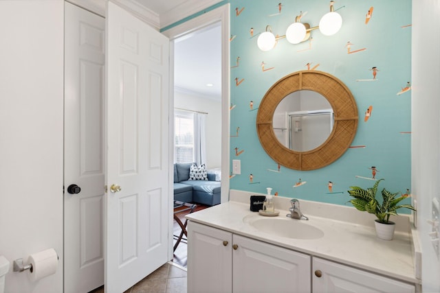 bathroom with oversized vanity, ornamental molding, and tile floors