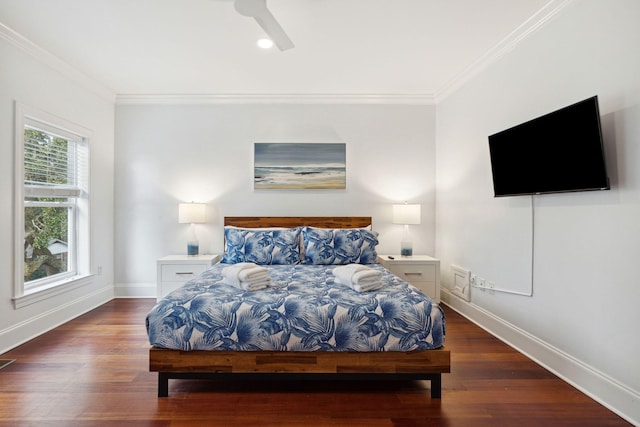 bedroom featuring ceiling fan, crown molding, and dark hardwood / wood-style floors