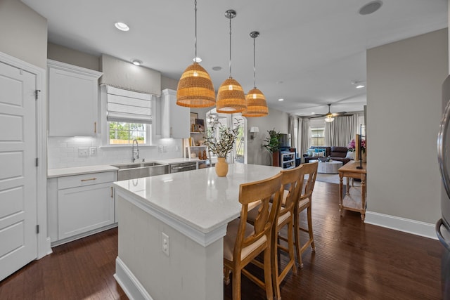255 Saxony Loop, Summerville, SC 29486 - kitchen featuring a sink, a center island, dark wood finished floors, a ceiling fan, and pendant lighting