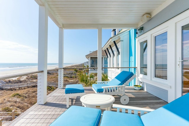 exterior space featuring a water view and a view of the beach