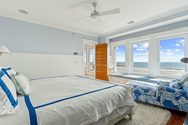 bedroom featuring ceiling fan, a wainscoted wall, visible vents, access to exterior, and ornamental molding