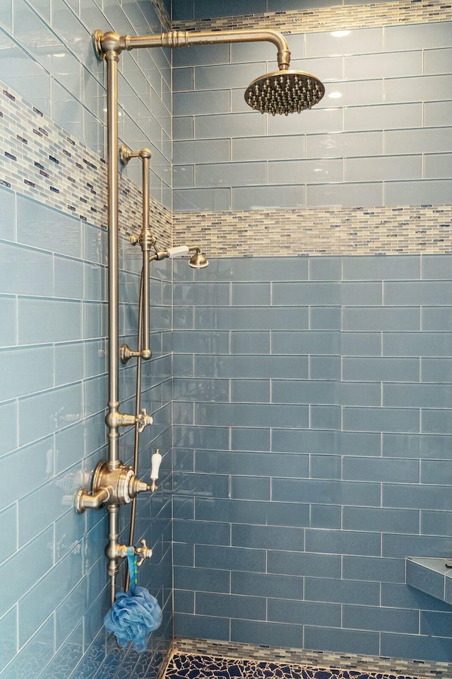 full bathroom with a tile shower