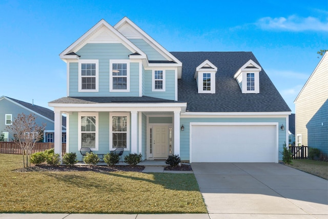 view of front of house featuring a front yard and a garage