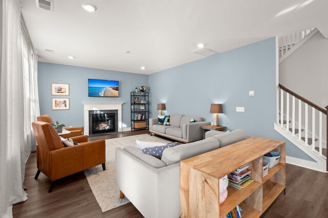 living room featuring dark hardwood / wood-style floors