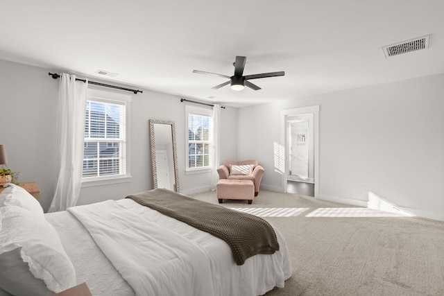 bedroom with light colored carpet and ceiling fan