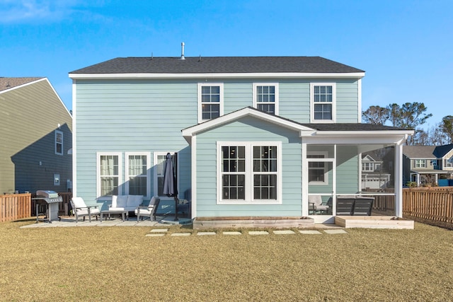 back of house with outdoor lounge area, a patio area, and a yard