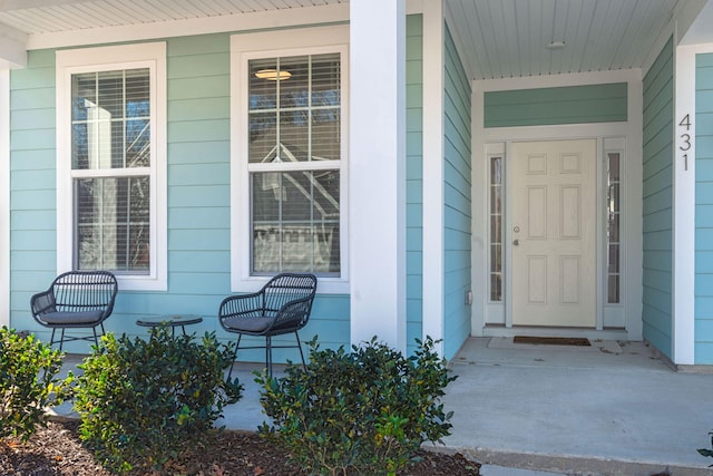 entrance to property featuring covered porch