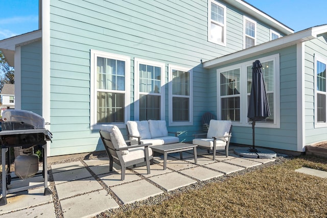 rear view of property with a patio area and an outdoor hangout area