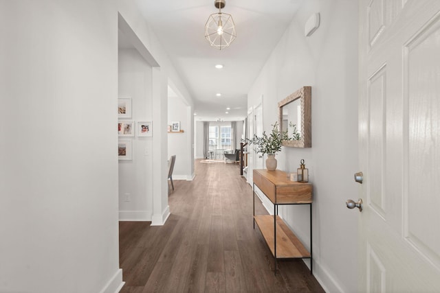 corridor featuring dark wood-type flooring