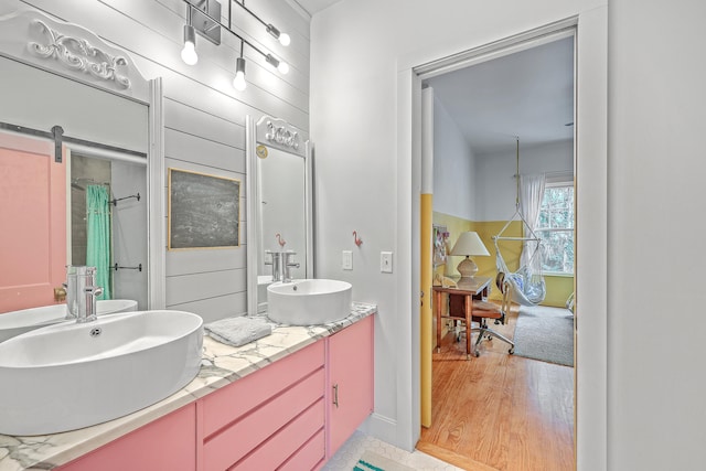 bathroom featuring vanity and hardwood / wood-style flooring