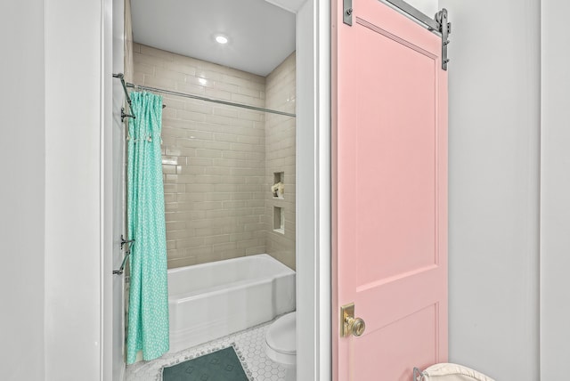 bathroom with shower / bath combo with shower curtain and toilet