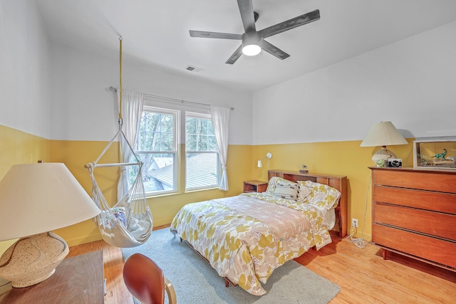 bedroom featuring light hardwood / wood-style flooring and ceiling fan