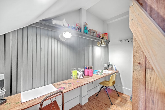 mudroom featuring light hardwood / wood-style floors and vaulted ceiling