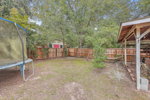 view of yard featuring a trampoline