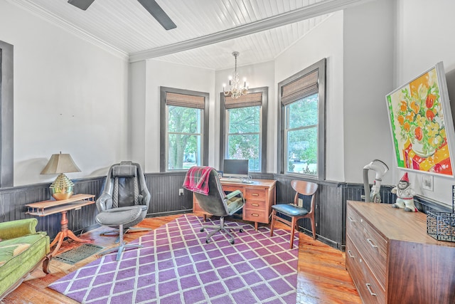 office area featuring light wood-type flooring, crown molding, ceiling fan with notable chandelier, and a wealth of natural light