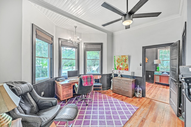 office with light hardwood / wood-style flooring, ornamental molding, and ceiling fan with notable chandelier