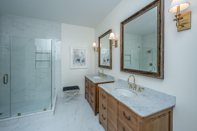 full bathroom with a marble finish shower, marble finish floor, two vanities, and a sink