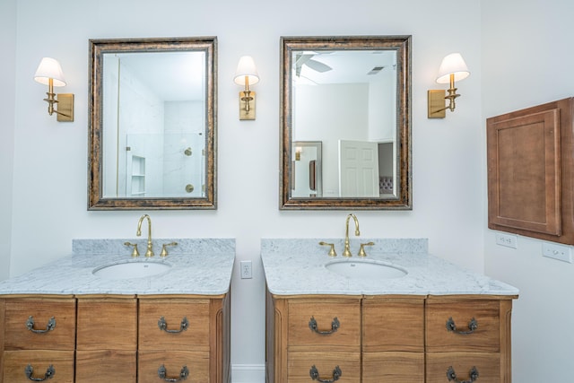 full bathroom with two vanities and a sink