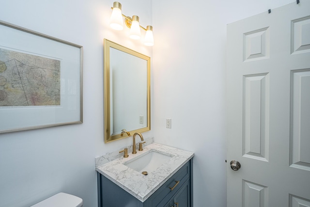 half bath with toilet and vanity