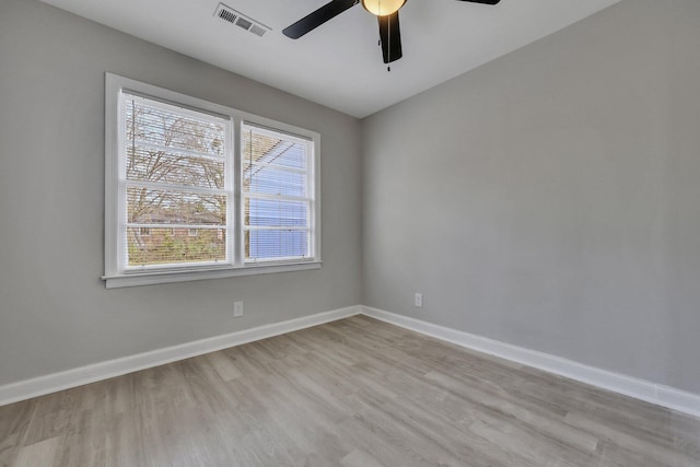 empty room featuring ceiling fan and light hardwood / wood-style floors