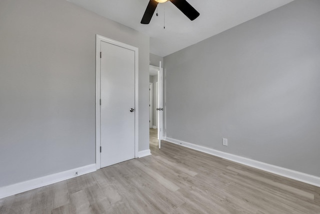 spare room featuring ceiling fan and light wood-type flooring