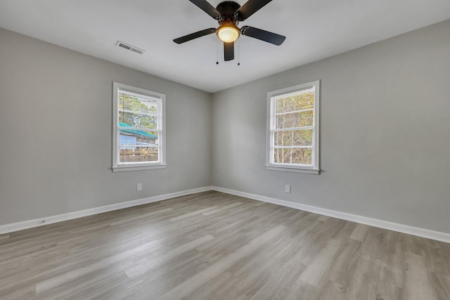 empty room featuring light hardwood / wood-style flooring and ceiling fan