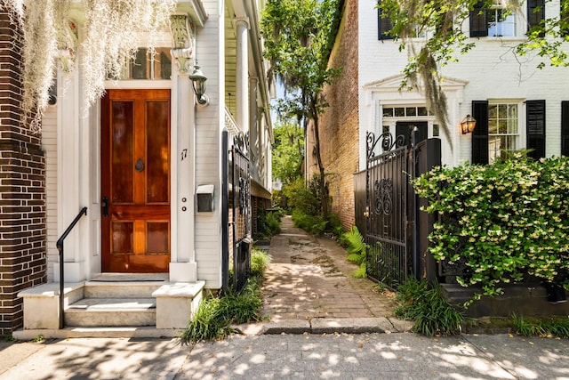entrance to property with brick siding