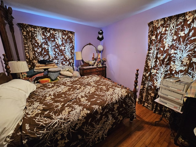 bedroom featuring wood finished floors