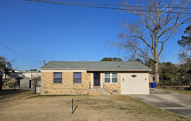 view of front of home featuring crawl space, roof with shingles, a front lawn, and brick siding