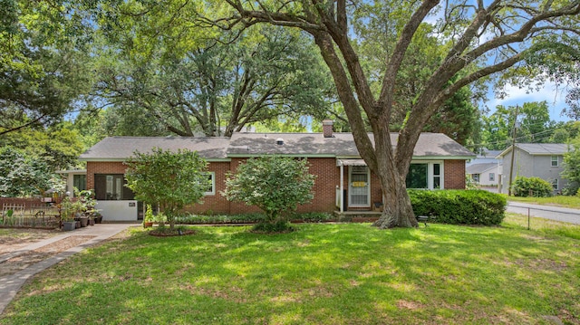 1549 N Avalon Cir, Charleston, SC 29407 - view of front of home featuring brick siding, a chimney, and roof with shingles