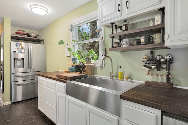 1549 N Avalon Cir, Charleston, SC 29407 - kitchen featuring butcher block counters, stainless steel fridge, a sink, open shelves, and white cabinetry