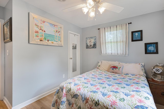 1549 N Avalon Cir, Charleston, SC 29407 - bedroom with light wood-style floors, baseboards, and a ceiling fan
