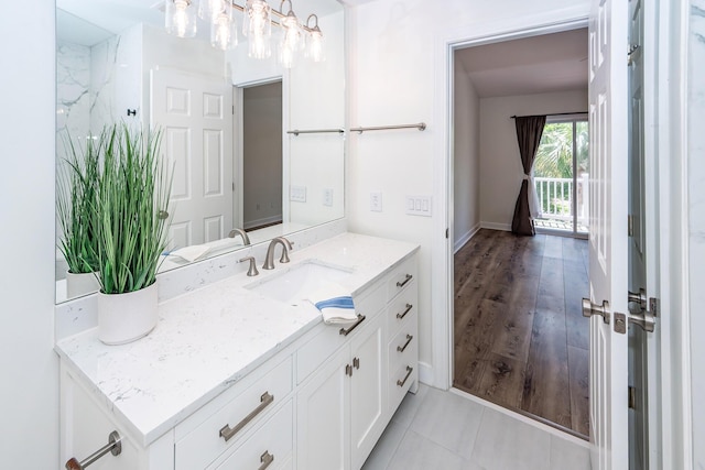 bathroom with vanity and baseboards