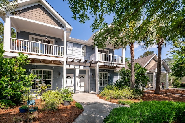 view of front of house featuring a balcony