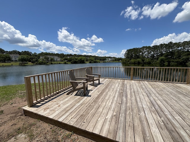 wooden deck with a water view